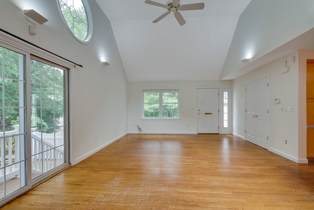 10 Rivard Road, Unit 10 Needham, MA 02492 - Photo 6 of 29 wooden floor in an empty room with a window