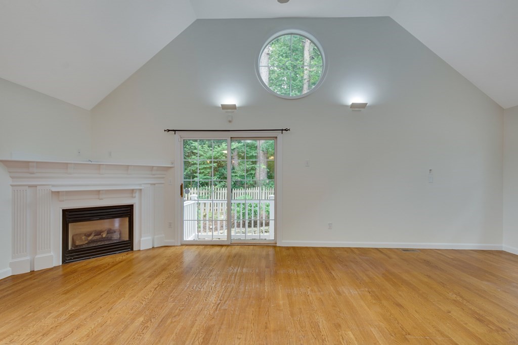 10 Rivard Road, Unit 10 Needham, MA 02492 - Photo 7 of 29 an empty room with a fireplace