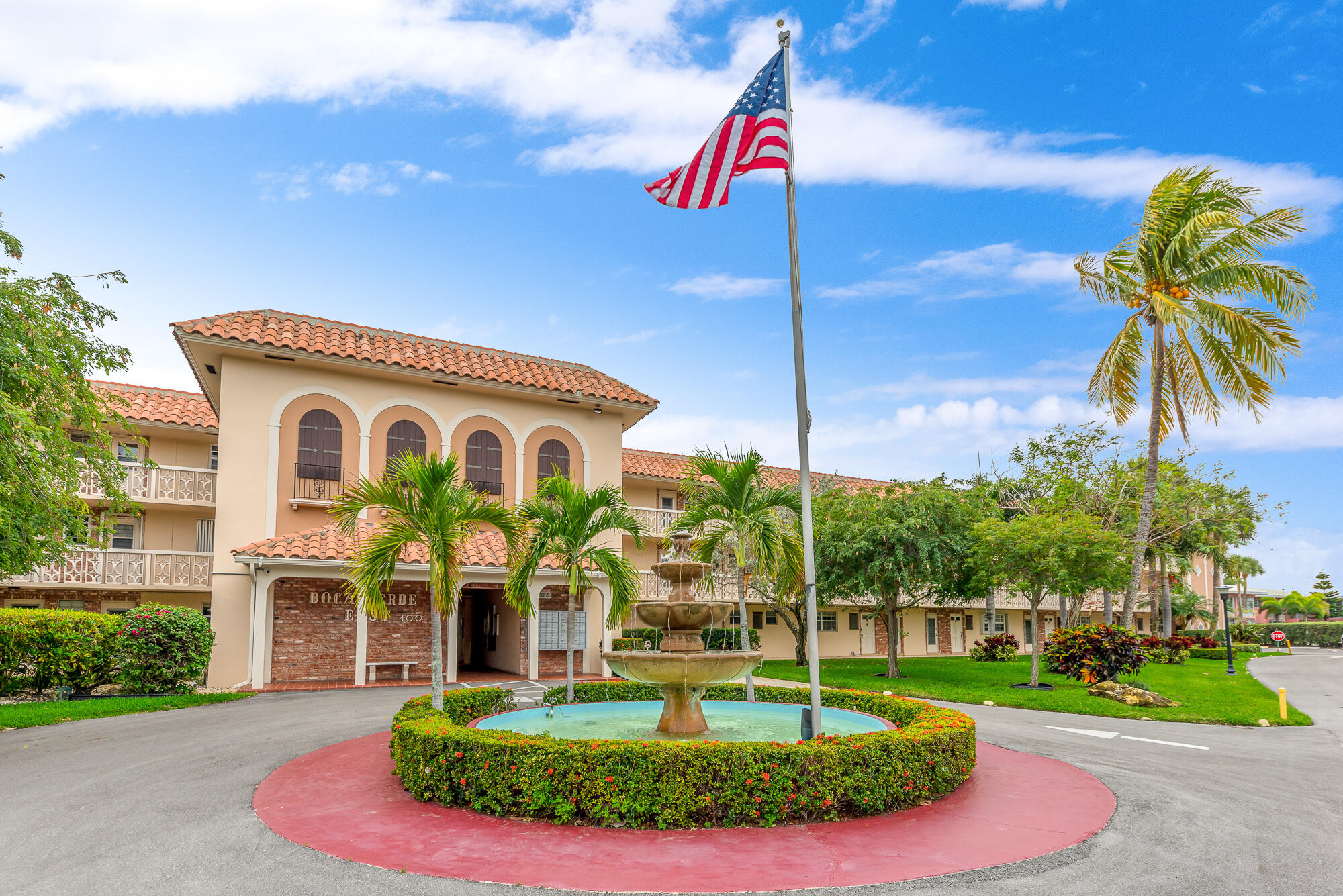 400 Northeast 20th Street, Unit D307 Boca Raton, FL 33431 - Photo 3 of 34 a front view of a house with a yard