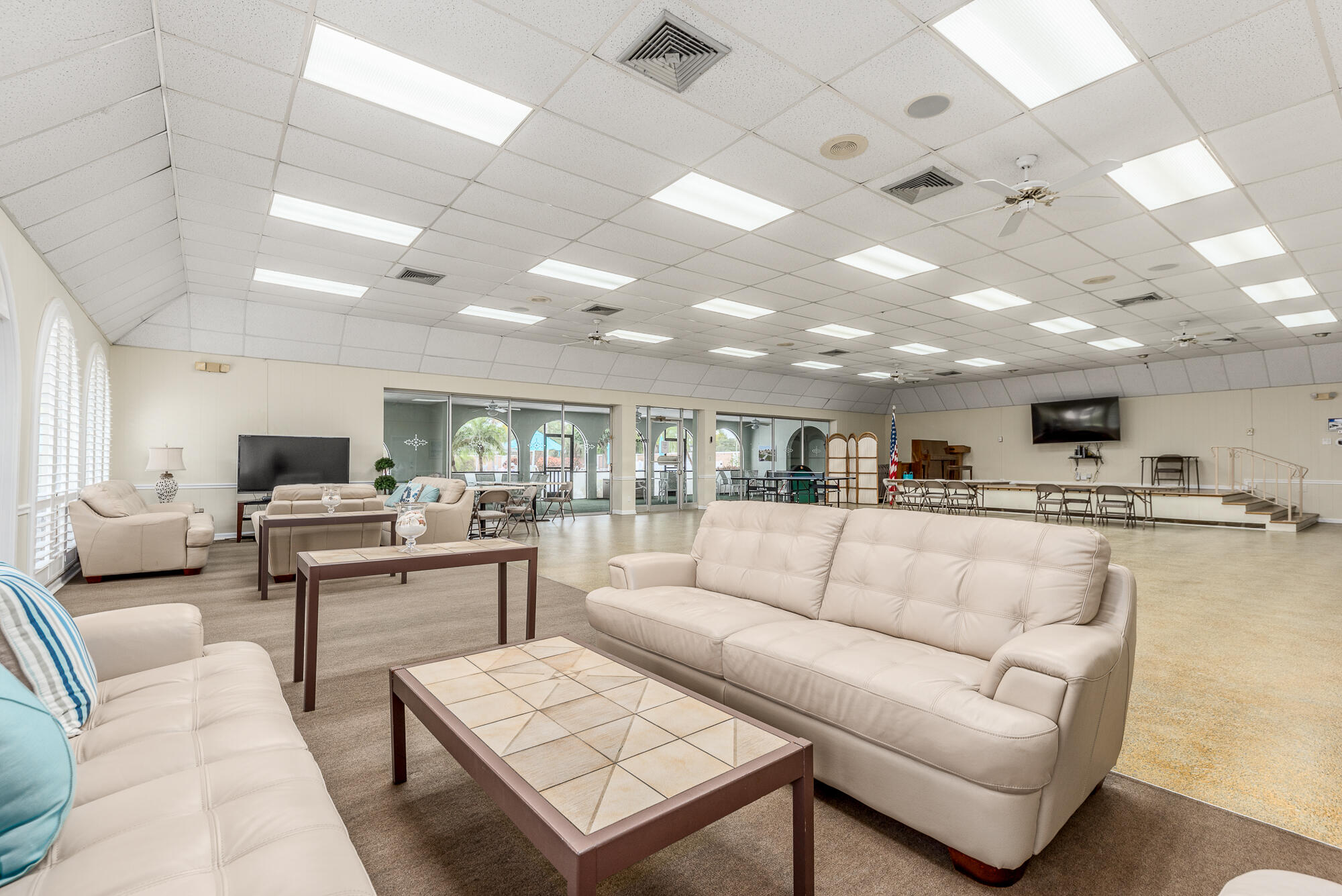 400 Northeast 20th Street, Unit D307 Boca Raton, FL 33431 - Photo 5 of 34 a living room with furniture kitchen view and a chandelier