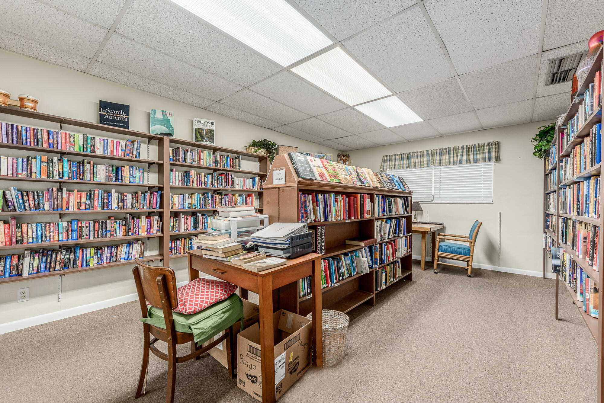 400 Northeast 20th Street, Unit D307 Boca Raton, FL 33431 - Photo 6 of 34 a reading room with furniture and a book shelf