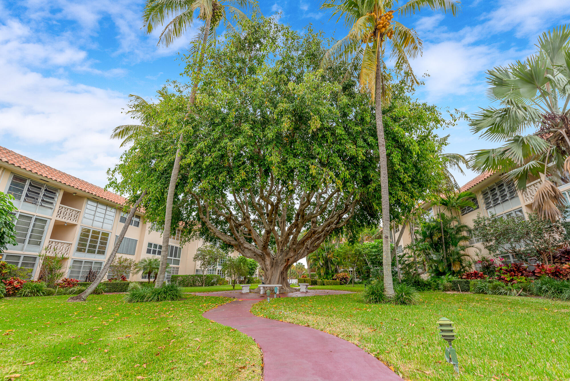 400 Northeast 20th Street, Unit D307 Boca Raton, FL 33431 - Photo 7 of 34 a view of a building with a yard