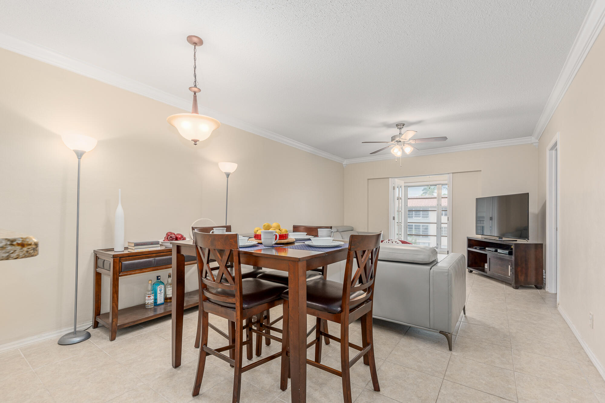400 Northeast 20th Street, Unit D307 Boca Raton, FL 33431 - Photo 10 of 34 a view of a dining room with furniture