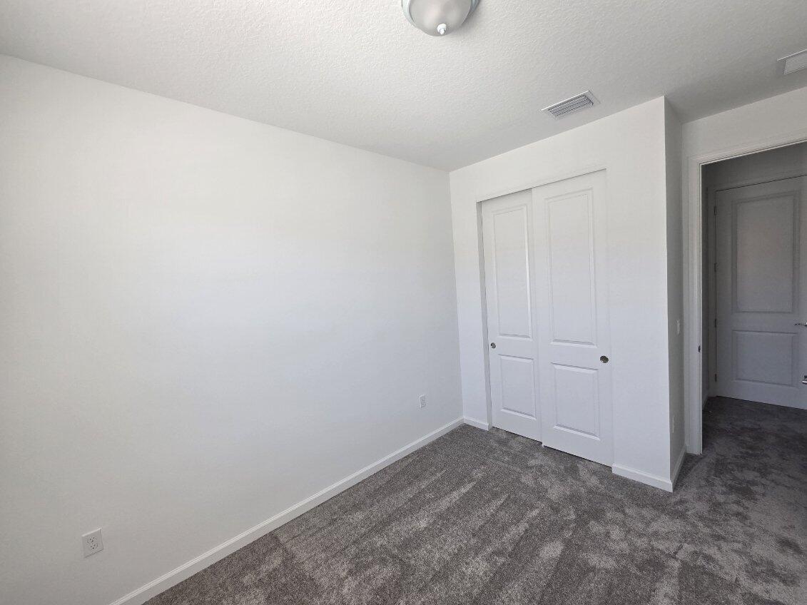 7783 Southwest Bentley Lane Stuart, FL 34997 - Photo 15 of 27 Bedroom 3