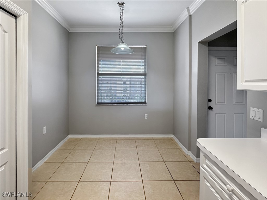 8451 Kingbird Loop, Unit 345 Estero, FL 33967 - Photo 6 of 10 a view of an empty room with a window