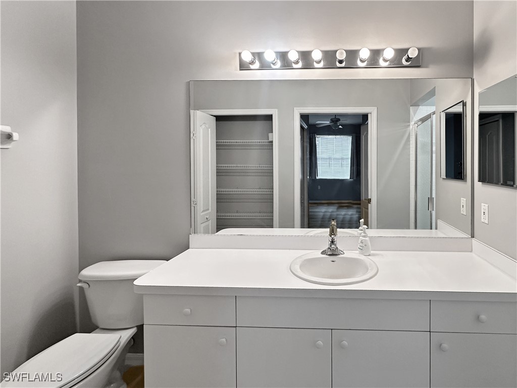 8451 Kingbird Loop, Unit 345 Estero, FL 33967 - Photo 8 of 10 a bathroom with a sink and a toilet