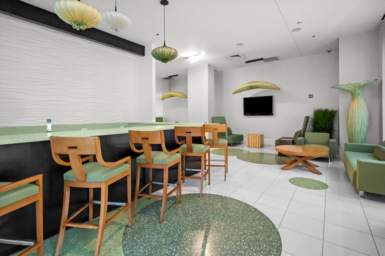 125 South Green Street, Unit 806A Chicago, IL 60607 - Photo 26 of 35 a living room with furniture a rug and a flat screen tv