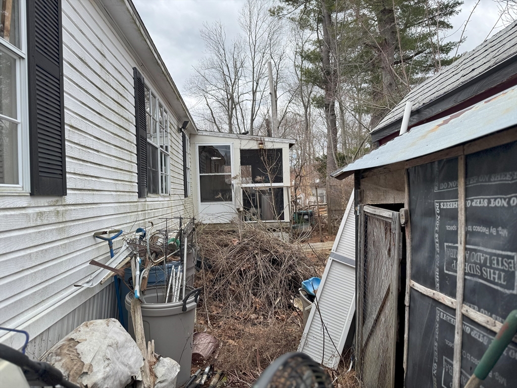 3 Adams Street Salisbury, MA 01952 - Photo 8 of 10 a view of a house with a bed and wooden fence