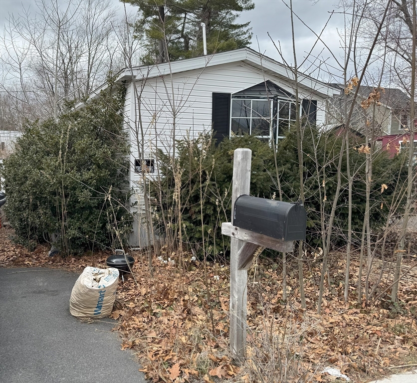 3 Adams Street Salisbury, MA 01952 - Photo 10 of 10 a view of a chair and table in backyard of the house