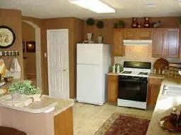 a kitchen with a stove and a refrigerator