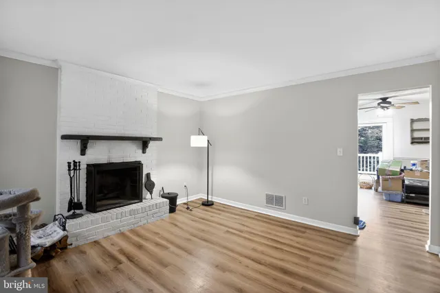 a bedroom with bed and a fireplace