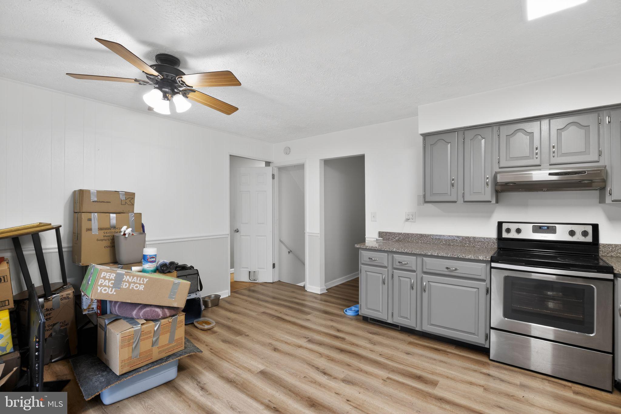 1201 North Tollgate Road Bel Air, MD 21014 - Photo 19 of 41 a kitchen with a stove a sink and a refrigerator