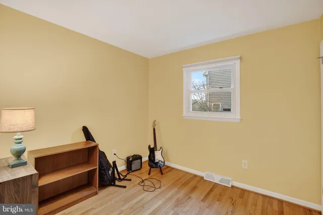 a view of workspace with wooden floor and chair