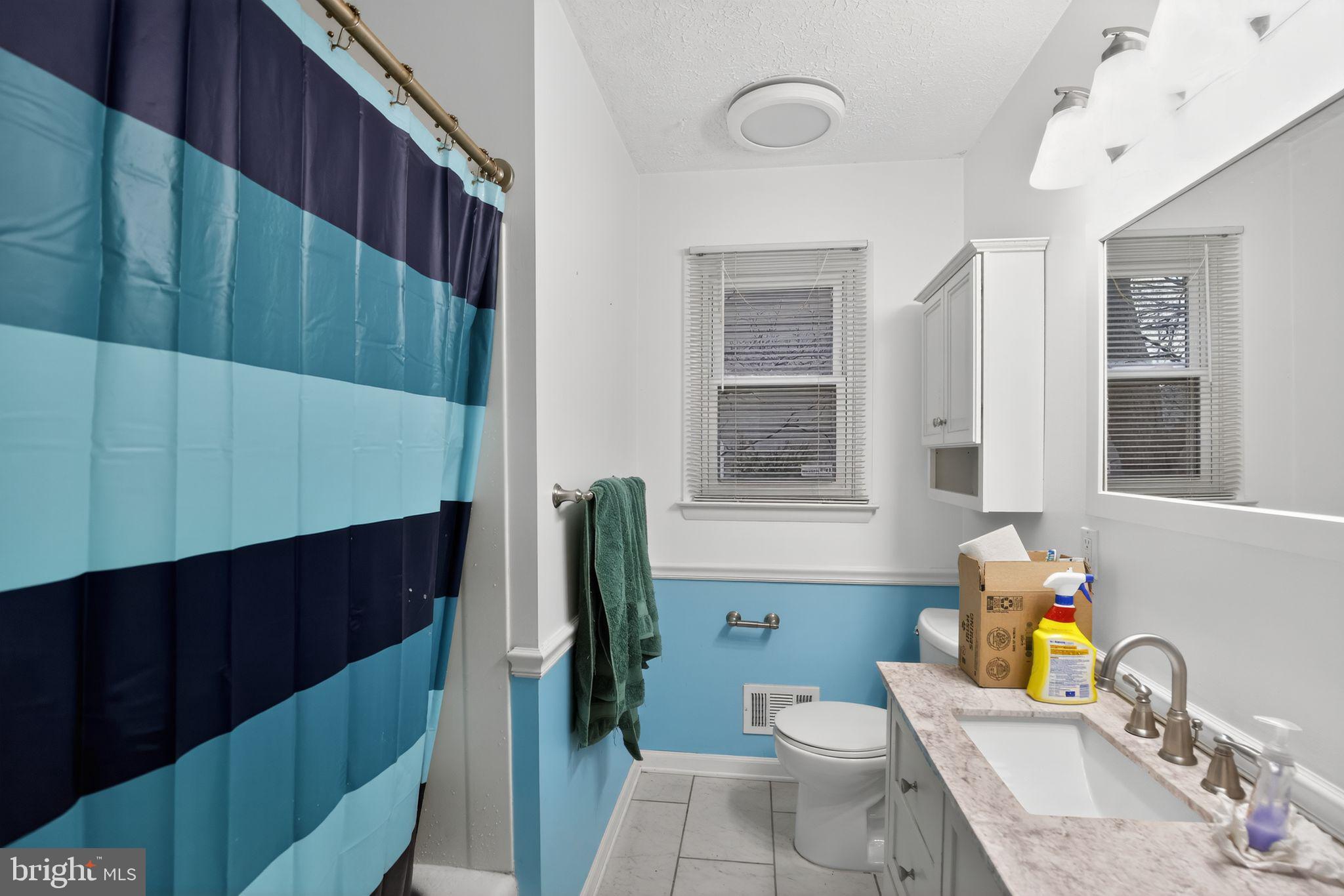 1201 North Tollgate Road Bel Air, MD 21014 - Photo 27 of 41 a bathroom with a sink toilet vanity and window