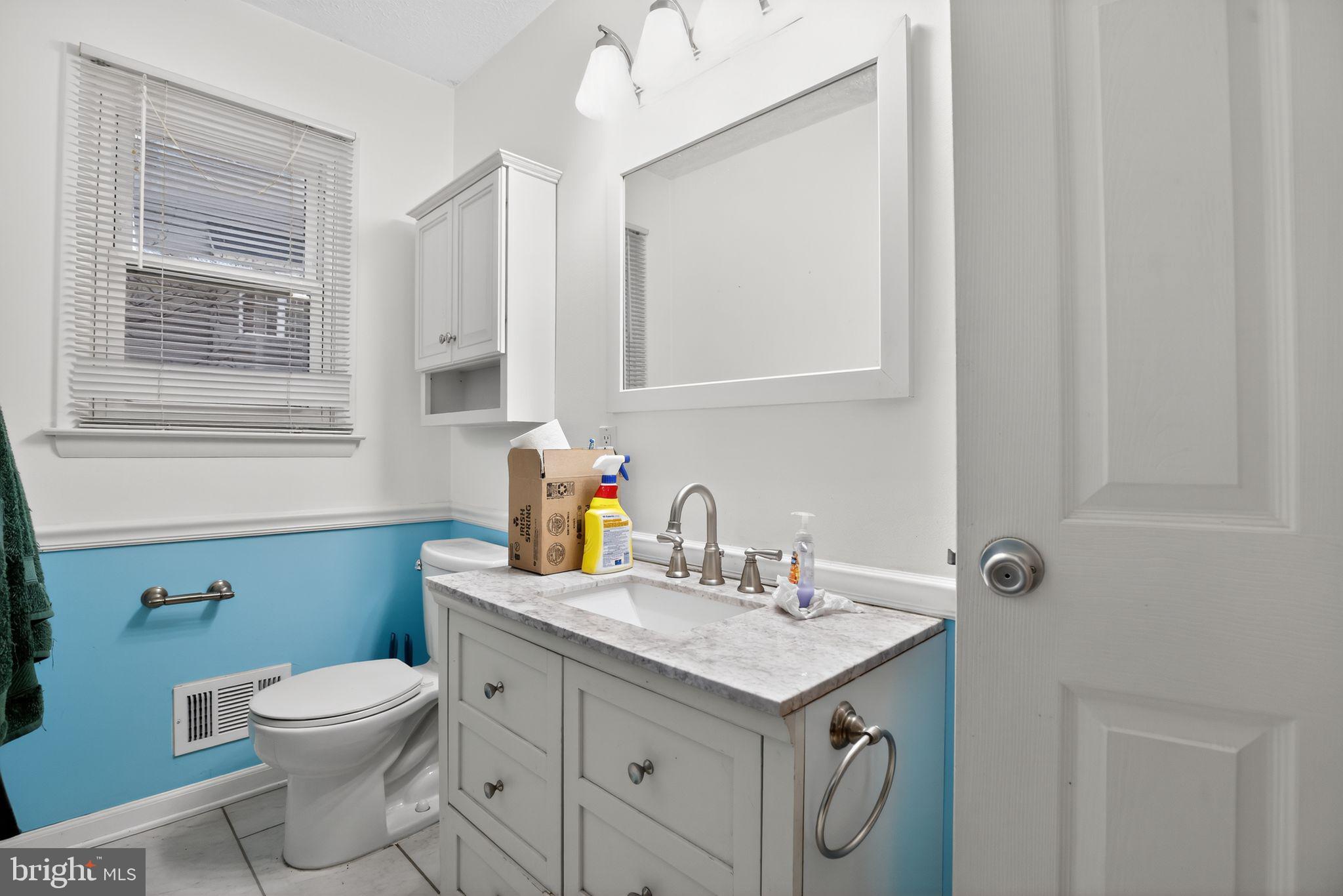 1201 North Tollgate Road Bel Air, MD 21014 - Photo 28 of 41 a bathroom with a granite countertop toilet sink and mirror
