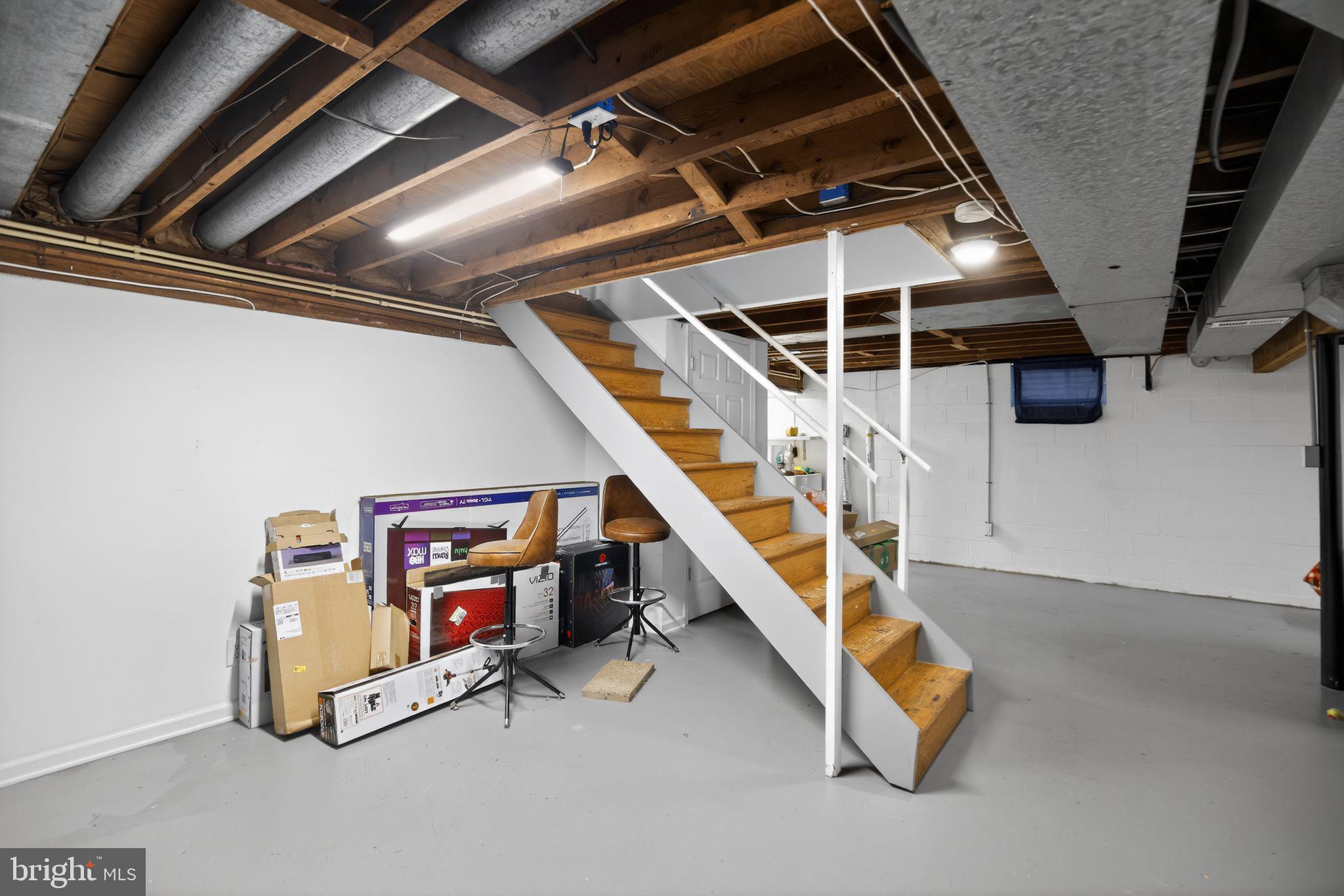 1201 North Tollgate Road Bel Air, MD 21014 - Photo 30 of 41 a room with gym equipment and stairs