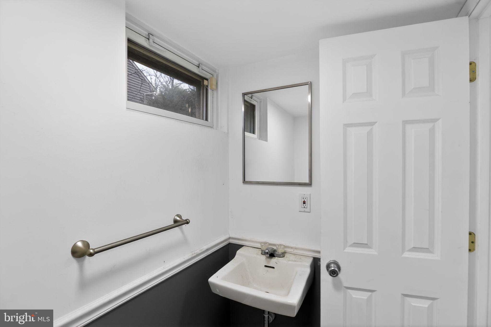 1201 North Tollgate Road Bel Air, MD 21014 - Photo 35 of 41 a bathroom with a sink and mirror