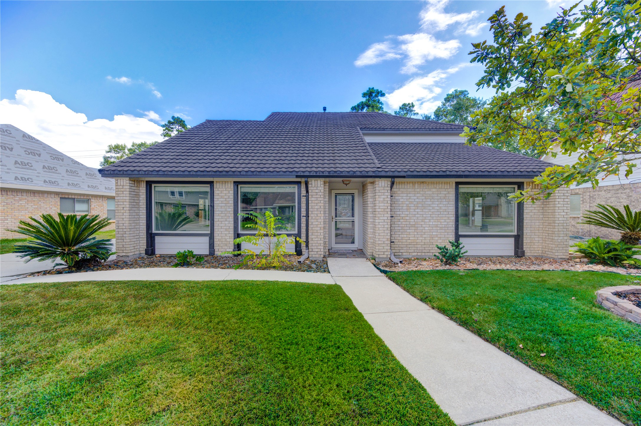3639 Fir Forest Drive Spring, TX 77388 - Photo 2 of 44 a front view of a house with a yard and porch