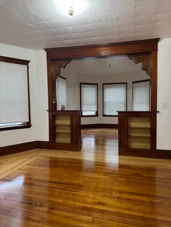 a view of a living room with a flat screen tv and fireplace