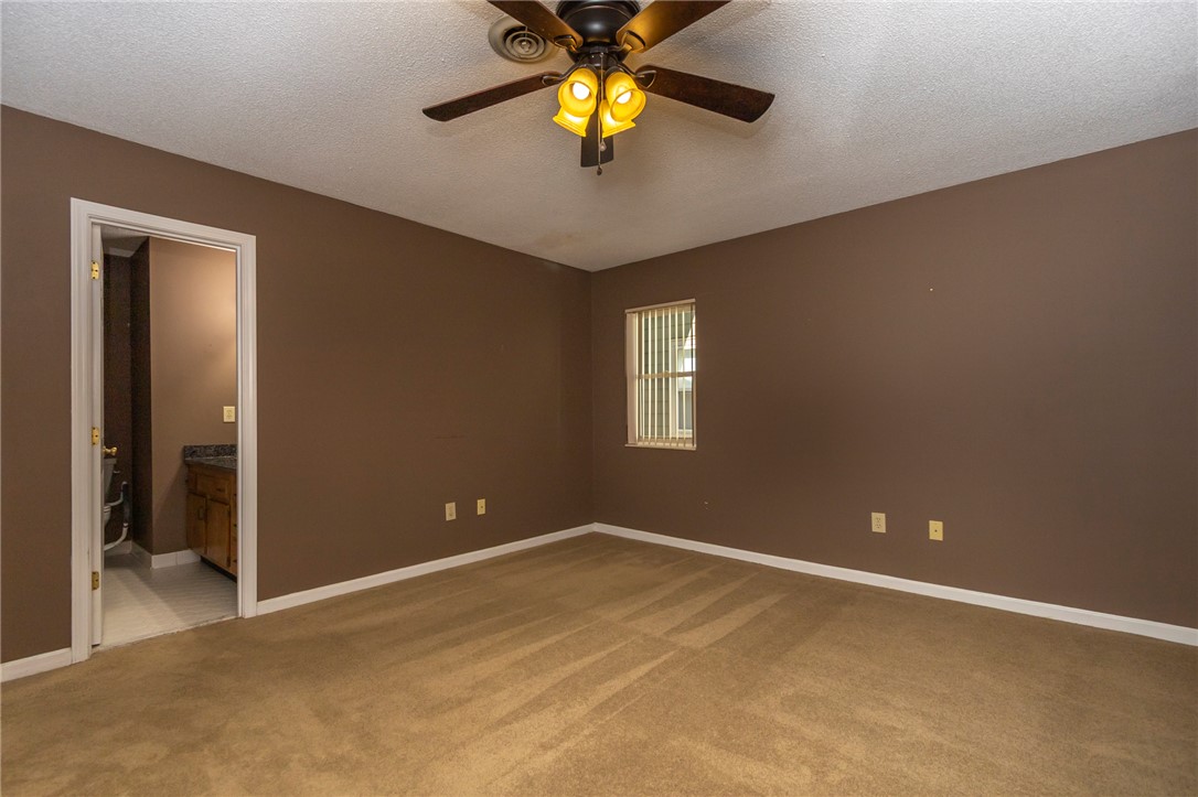1302 Leeward Road Anderson, SC 29625 - Photo 24 of 50 Comfortable carpeting and a ceiling fan create a cozy, inviting atmosphere.