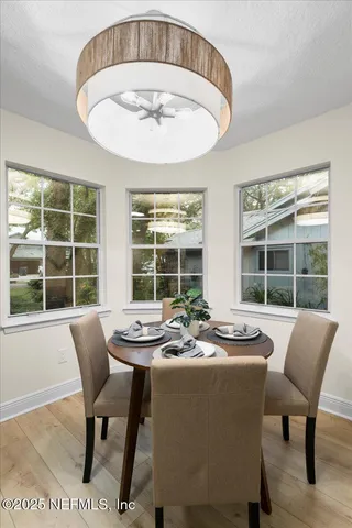 a view of a dining room with furniture window and outside view