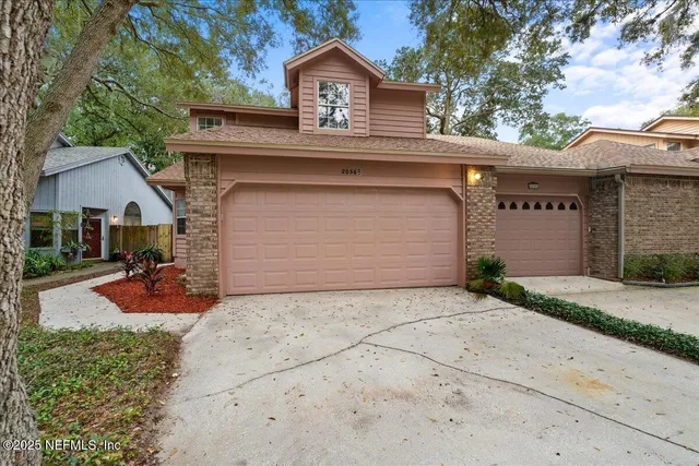 a front view of a house with yard