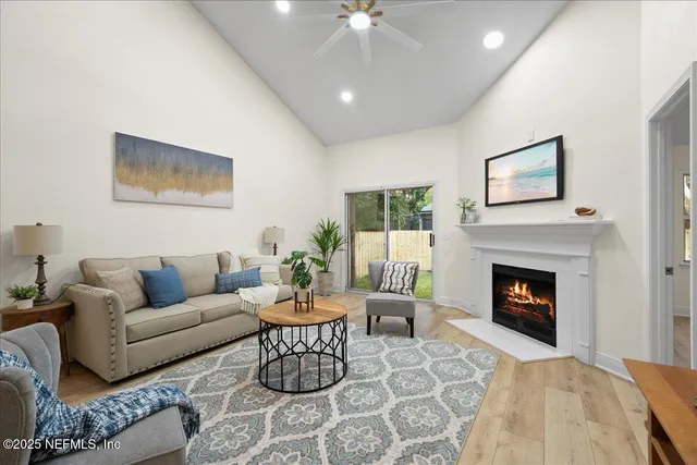 a living room with furniture and a fireplace