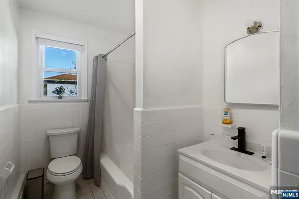 a bedroom with a bed and a lamp