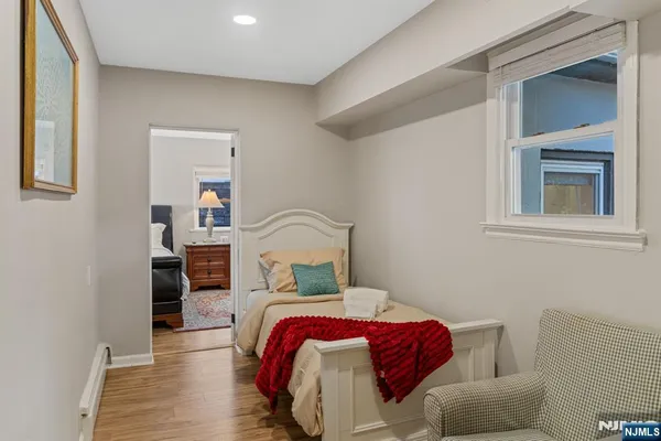 a bed room with a bed and a television
