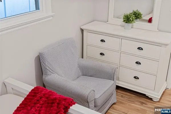 a living room with furniture and a lamp