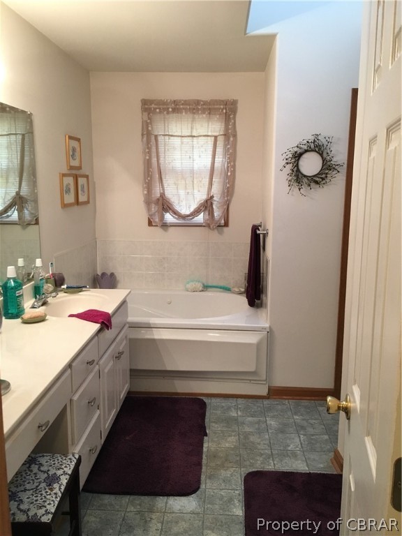 2573 Wright Road Saluda, VA 23149 - Photo 15 of 30 Master bath with garden tub, shower, toilet room with pedestal sink