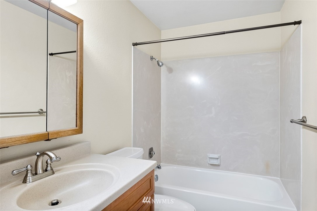 16505 23rd Avenue Southeast Bothell, WA 98012 - Photo 15 of 33 a bathroom with a sink and a mirror