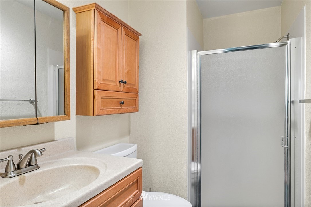 16505 23rd Avenue Southeast Bothell, WA 98012 - Photo 19 of 33 a bathroom with a sink and a mirror