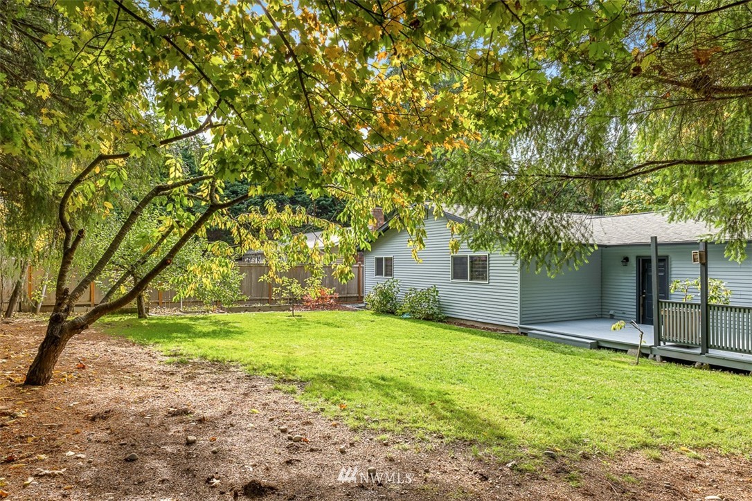 16505 23rd Avenue Southeast Bothell, WA 98012 - Photo 28 of 33 a backyard of a house with yard and tree