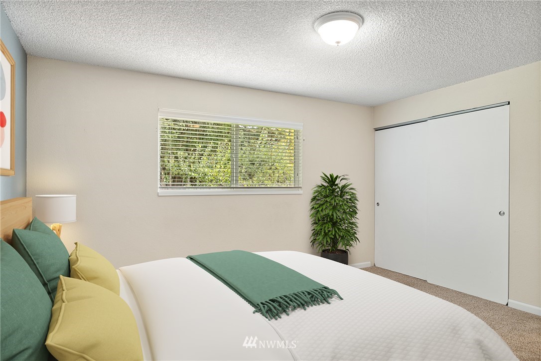 16505 23rd Avenue Southeast Bothell, WA 98012 - Photo 6 of 33 a bedroom with a bed and a window
