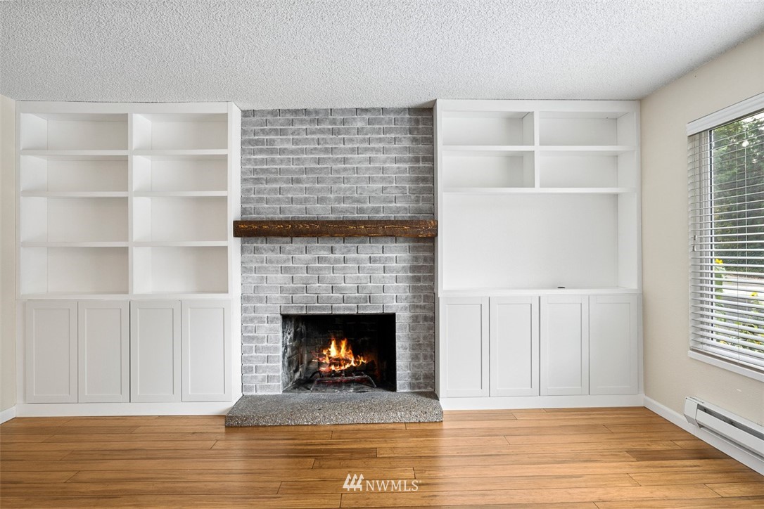 16505 23rd Avenue Southeast Bothell, WA 98012 - Photo 10 of 33 a view of an empty room with a window and fireplace