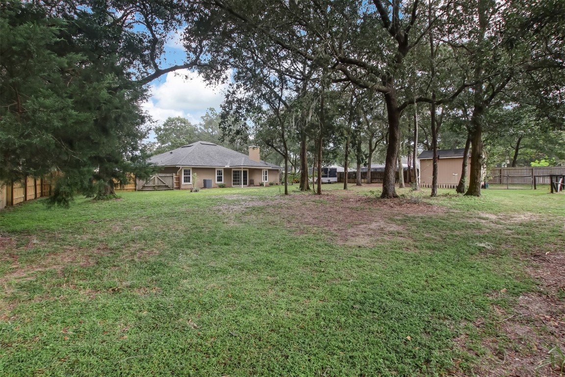 97095 Chimney Ridge Court Yulee, FL 32097 - Photo 26 of 28 a front view of a house with a yard