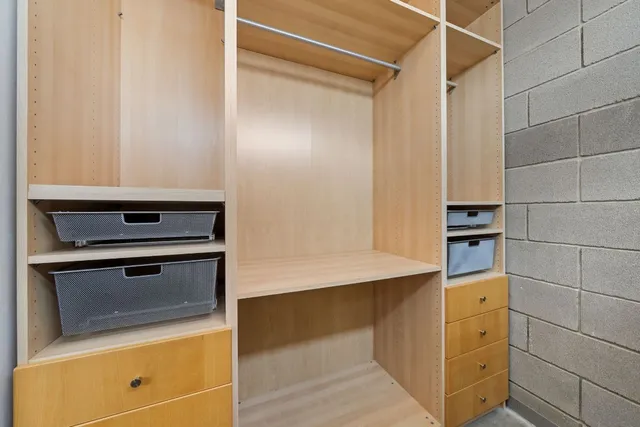 a view of a house with a small yard and wooden floor