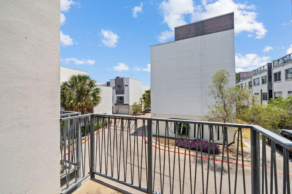4801 South Congress Avenue, Unit D4 Austin, TX 78745 - Photo 26 of 27 a view of a balcony with wooden floor