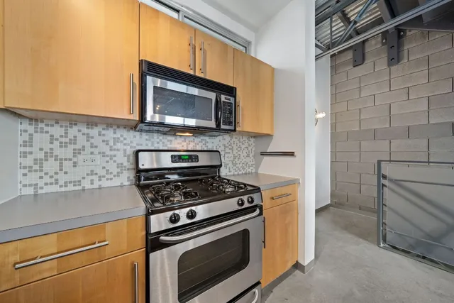 a kitchen with a stove and a microwave