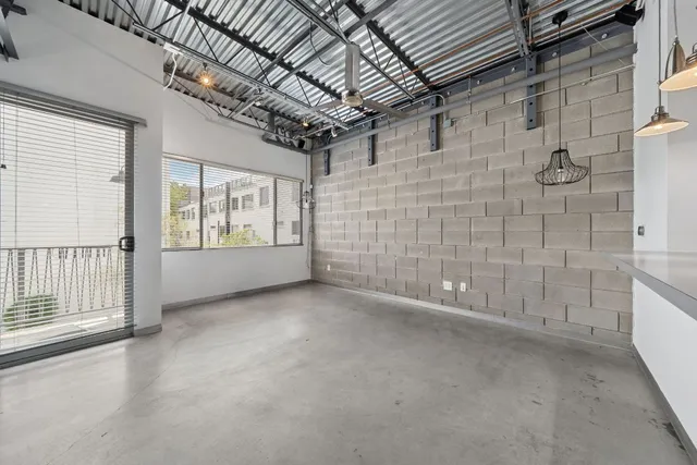 a view of empty room with windows