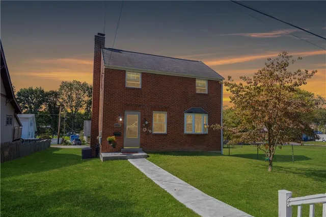 a brick building with a yard