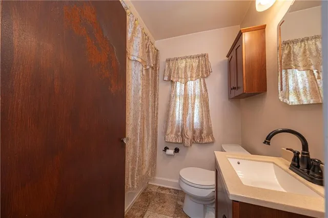 a building outdoor space with patio furniture and potted plants