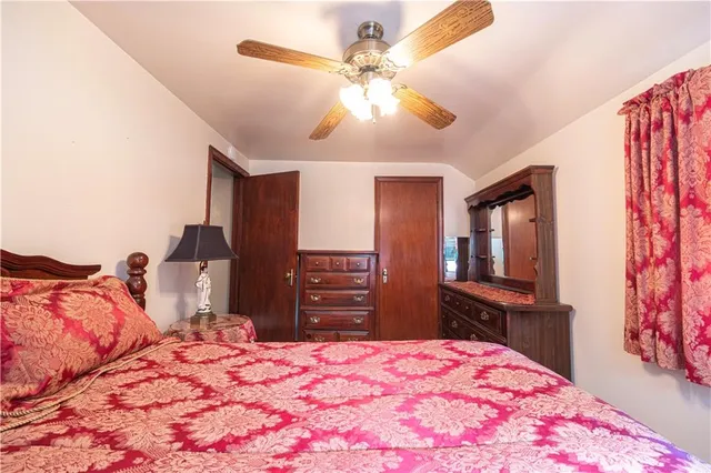 a bedroom with a bed and a dresser