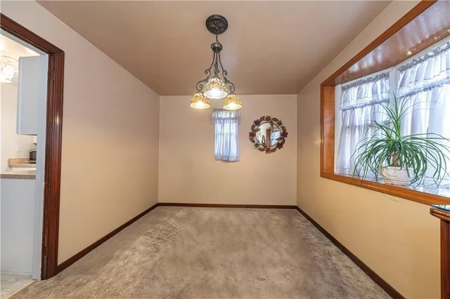 a view of a room with window and glass door