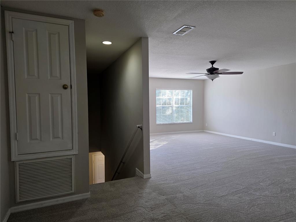 1645 Algonkin Loop Orlando, FL 32828 - Photo 25 of 37 an empty room with windows and closet
