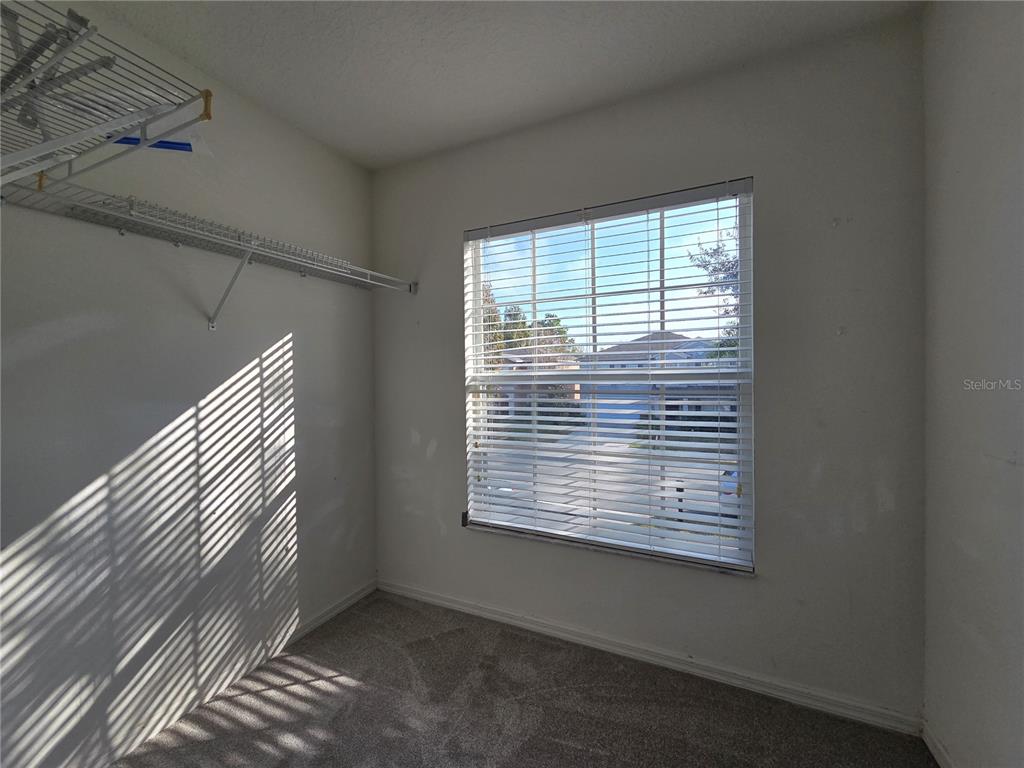 1645 Algonkin Loop Orlando, FL 32828 - Photo 27 of 37 a view of a room that has a window and ceiling fan