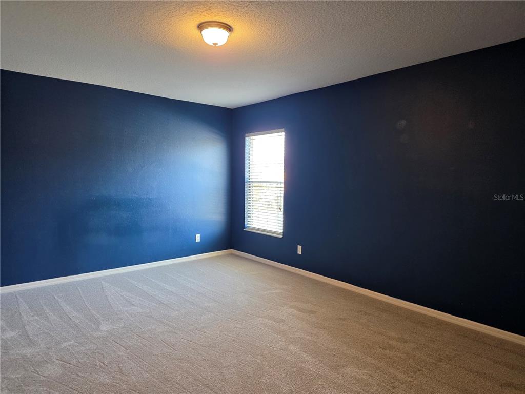 1645 Algonkin Loop Orlando, FL 32828 - Photo 31 of 37 a view of an empty room with a window