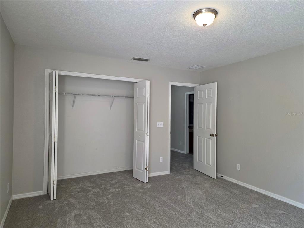 1645 Algonkin Loop Orlando, FL 32828 - Photo 33 of 37 an empty room with closet