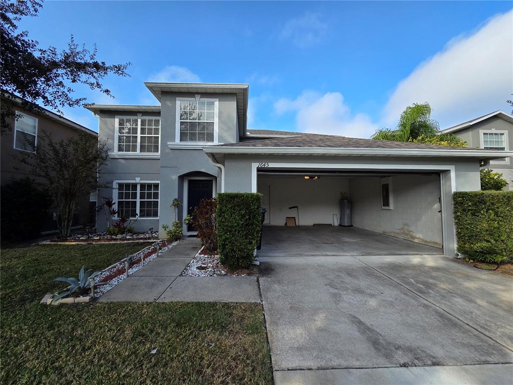 1645 Algonkin Loop Orlando, FL 32828 - Photo 37 of 37 a view of a house with a yard and sitting area